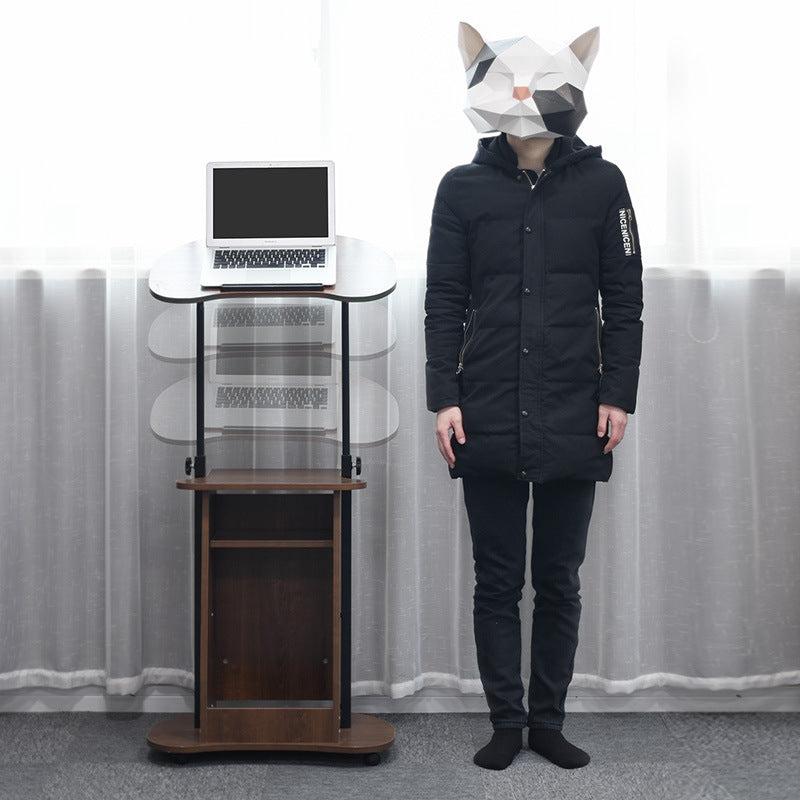 Height-adjustable computer desk, standing and movable.